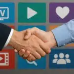 Two people shaking hands in front of digital TV app icons, symbolizing IPTV reseller business partnership and streaming collaboration.